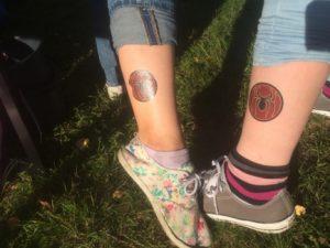 Two new female students show off the Chemigate colors on their legs.